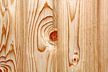 Wooden boards close-up with a view of the structure of the tree and knotsの写真素材