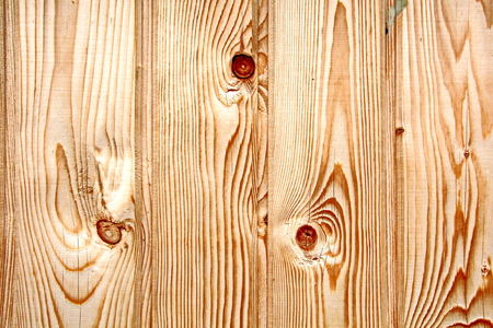 Wooden boards close-up with a view of the structure of the tree and knotsの写真素材