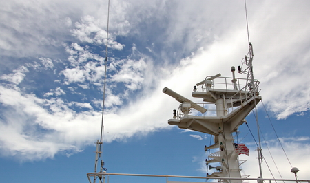 State flags raised on the mast of a merchant ship in the ports of call. Different kinds of flags...