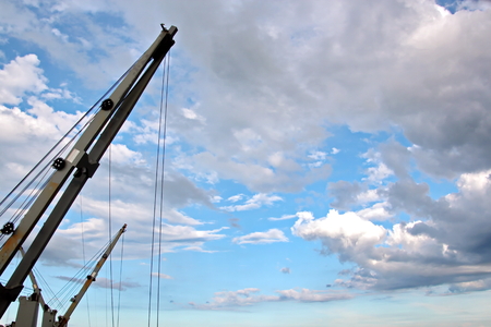 Ship structures, masts, antennas, funnel, ship wheelhouse against the blue sky and clouds.の写真素材