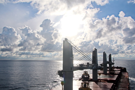 Ship structures, masts, antennas, funnel, ship wheelhouse against the blue sky and clouds.の写真素材