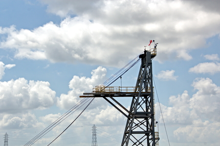 Ship structures, masts, antennas, funnel, ship wheelhouse against the blue sky and clouds.の写真素材