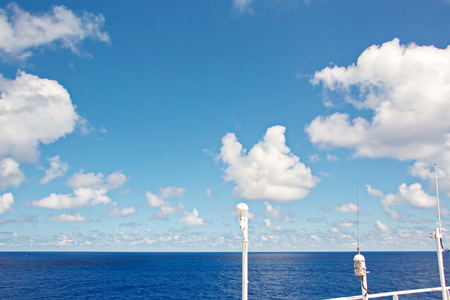 Ship structures, masts, antennas, funnel, ship wheelhouse against the blue sky and clouds.の写真素材
