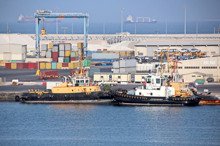 Type of port berths with moored vessels. Port of Salalah, Oman.の写真素材