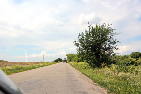Landscape views of nature, fields, villages, Ukraine. View from the car window when driving.の写真素材