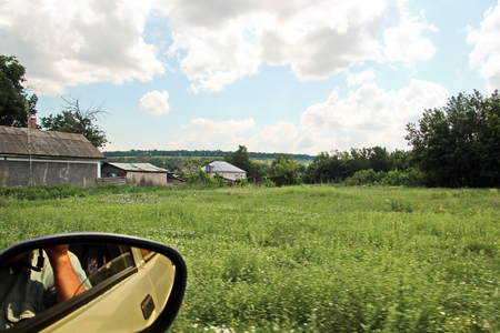 Landscape views of nature, fields, villages, Ukraine. View from the car window when driving.の写真素材