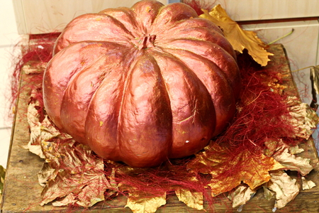 Close-up view of pumpkin and autumn leaves used for decoration on the Halloween holiday.の写真素材