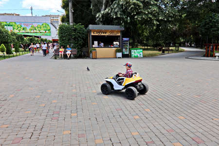 Odessa, Ukraine. March 2020. Active leisure for children on the playground, cycling, cars and roller...