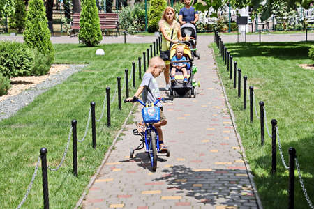 Odessa, Ukraine. March, 2020. Family Day. Parents' active leisure on foot with children in...