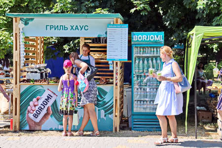 Odessa, Ukraine. March, 2020. Family Day. Parents' active leisure on foot with children in wheelchairs, roller skates, bicycles on city streets and in the park.のeditorial素材