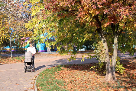 Odessa, Ukraine. October, 2018. Family Day. Parents' active leisure on foot with children in wheelchairs, roller skates, bicycles on city streets and in the park.のeditorial素材