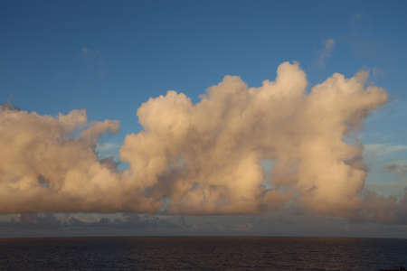Seascape, blue sky, clouds and sea in the tropical waters of the Pacific Ocean.