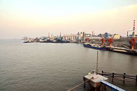 Cargo terminal for unloading grain cargo by coastal cranes. Port Jiangyin, China. December, 2019.の写真素材
