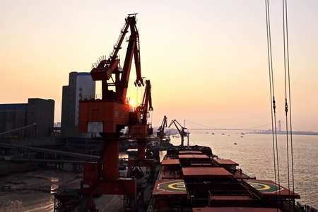 Night views of cargo terminal for unloading grain cargo.Sunrise. Port Jiangyin, China. December,...
