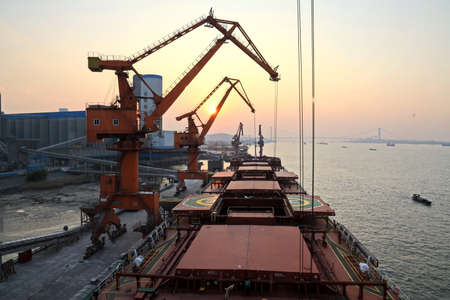 Night views of cargo terminal for unloading grain cargo.Sunrise. Port Jiangyin, China. December,...
