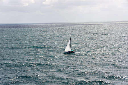 Seagoing vessels, tugboats and yachts, on the roads of the port of Gladstone, Australia. December,...