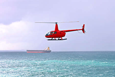 A helicopter used to receive a pilot on a sea vessel. Gladstone QLD, Australia