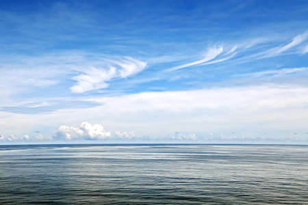 Seascape, blue sky, clouds and sea in the tropical waters of the Pacific Ocean.