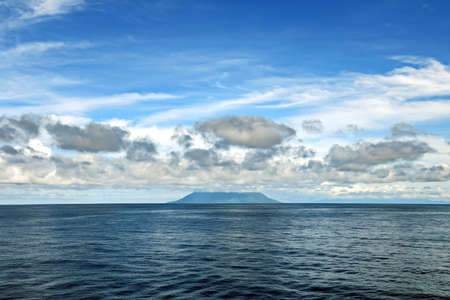Seascape, blue sky, clouds and sea in the tropical waters of the Pacific Ocean.