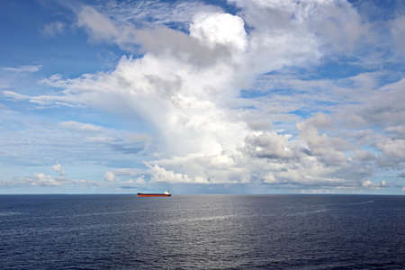 Seascape, blue sky, clouds and sea in the tropical waters of the Pacific Ocean.