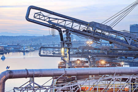 Night views of cargo terminal for loading grain cargo by shore cranes. Port Tacoma, WA, USA. October, 2019.の写真素材
