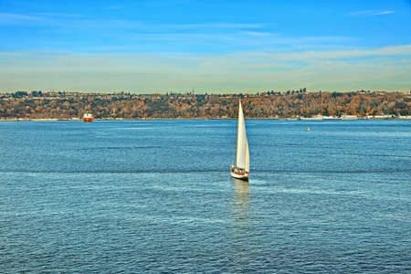 Seagoing vessels, tugboats, pleasure boats and yachts on the roads of the port of Tacoma, USA....