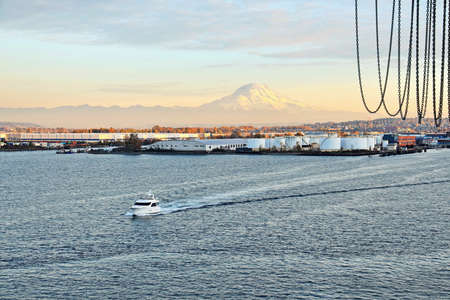 Seagoing vessels, tugboats, pleasure boats and yachts on the roads of the port of Tacoma, USA. October, 2019.の写真素材