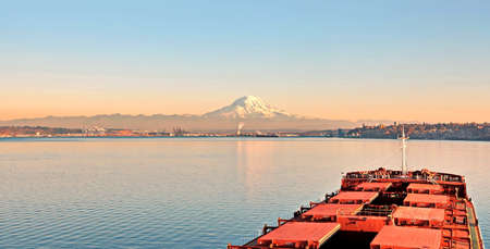 Mount Rainier over Tacoma, Washington, USA. Views of the volcano from the side of Commensement Bay....