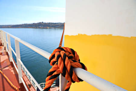 Tacoma, WA, USA, October, 23-25, 2019. MV Egyptian Mike. Repainting the ship's funnel and drawing the logo of the shipowner with members of the ship's crew.のeditorial素材