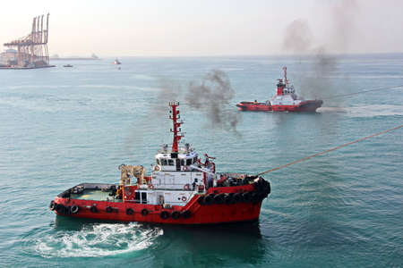 Various types of vessels calling at the port and moored at the berth. Tugs in the port. Jeddah Port,...