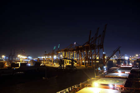 Night views of ships and berths in the port. Colorful views, the play of colors at sunset. Port Jeddah, Saudi Arabia. December, 2018の写真素材