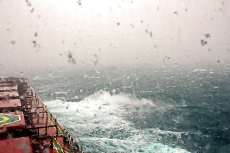 Before the storm. A painted view of storm and rain clouds and the sky above the sea horizon. View from the side of a sea ship while driving and in the port at anchor.の写真素材
