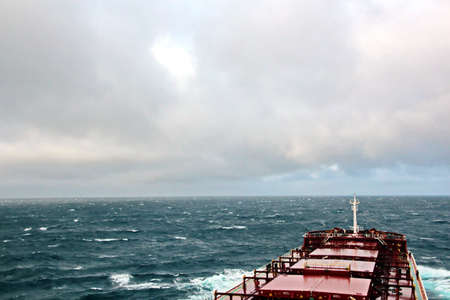 Before the storm. A painted view of storm and rain clouds and the sky above the sea horizon. View from the side of a sea ship while driving and in the port at anchor.の写真素材