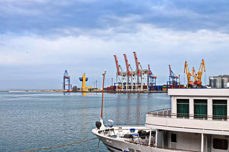 Port of Odessa, Ukraine, March, 06, 2020. Views of container and cargo berths with sea vessels, tugs and yachts in the port.のeditorial素材