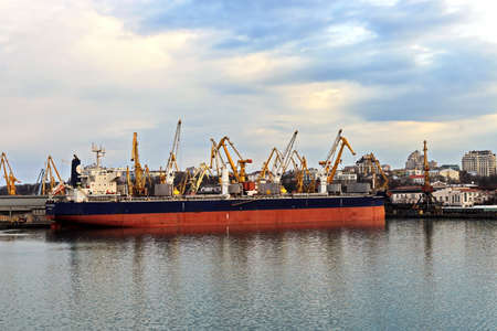 Port of Odessa, Ukraine, March, 06, 2020. Views of container and cargo berths with sea vessels, tugs and yachts in the port.の写真素材