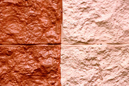Stone laying, bricks, shell rock and cement coating used in the architecture of the background and...