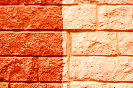 Stone laying, bricks, shell rock and cement coating used in the architecture of the background and...
