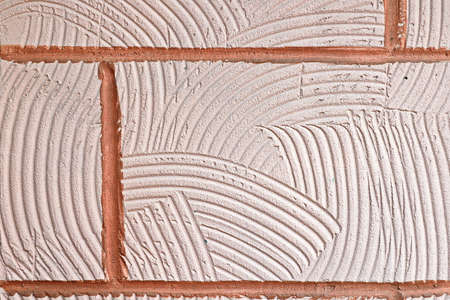 Stone laying, bricks, shell rock and cement coating used in the architecture of the background and base.の写真素材