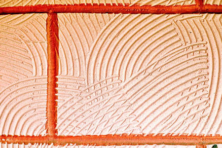 Stone laying, bricks, shell rock and cement coating used in the architecture of the background and...