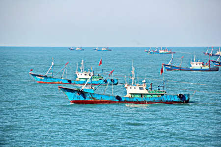 Fishing boats engaged in fishing in the South China Sea.の写真素材