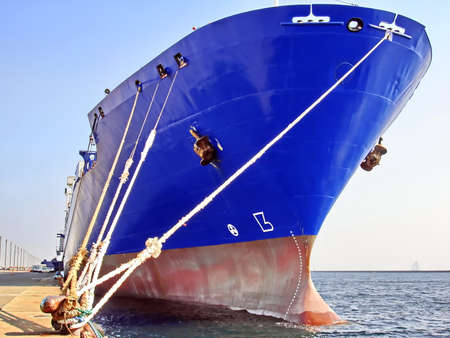 Ro-Ro is a specialized vessel for transporting vehicles and containers in the port and on the high seas.の写真素材