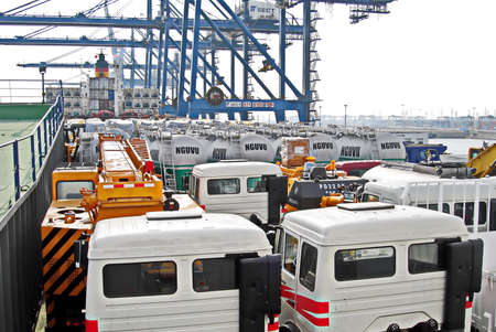 Shanghai, China, October 24, 2008. Loading heavy equipment and trucks aboard a Ro-Ro vessel in the...