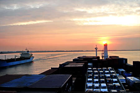 Passage of a large Ro-Ro ship by the river Seine to the port of Rouen.