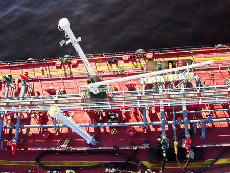 View of the bunker barge at the alongside of the vessel in the roads.の写真素材