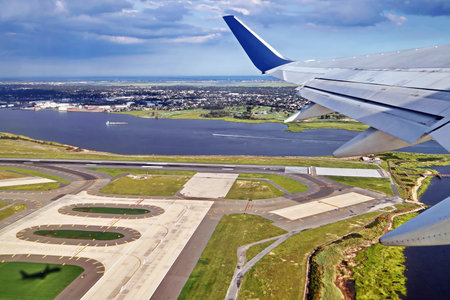 Under the wing of the plane. Panoramic views of the sky and the earth from the window of the plane....