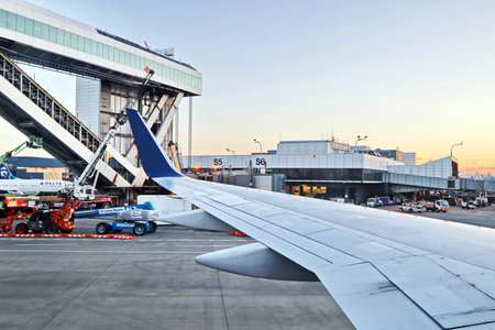 New York & Seatle, USA. 18 August 2020. Airport terminal. Plane landing and taxiing to the place of...