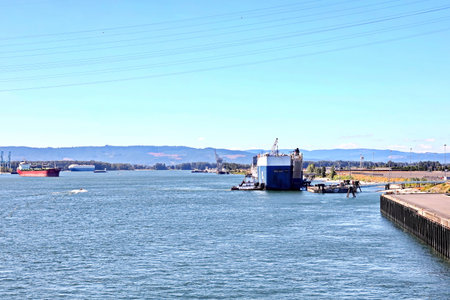 Seagoing vessels and tugboats at the roads and Columbia river of the port of Vancouver, WA, USA....