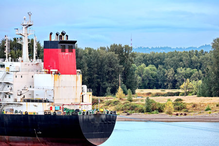Seagoing vessels and tugboats at the roads and Columbia river of the port of Vancouver, WA, USA....