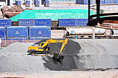 Jinzhou, China, September 18,2020. Cargo terminal for unloading bulk cargoes by shore cranes and grabs. Views of cargo equipment for discharging of bulk cargoes.のeditorial素材