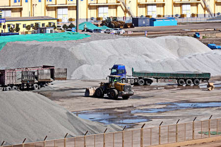Jinzhou, China, September 18,2020. Cargo terminal for unloading bulk cargoes by shore cranes and grabs. Views of cargo equipment for discharging of bulk cargoes.のeditorial素材